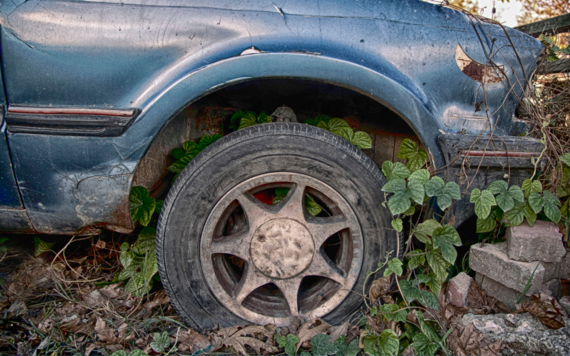 Close up of the wheel of an abandoned vehicle