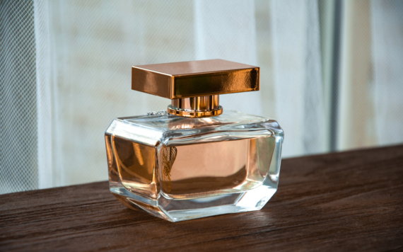 A glass fragrant bottle with a lid on 