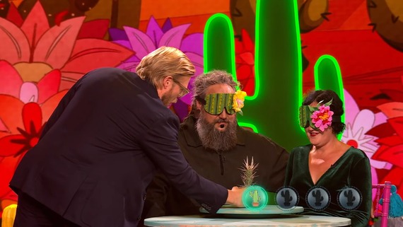 A blindfolded couple preparing to identify a cactus using only their tongues