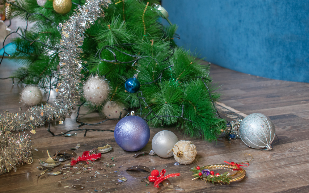 A knocked over smashed Christmas tree