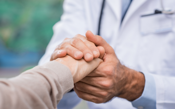 Two people holding hands