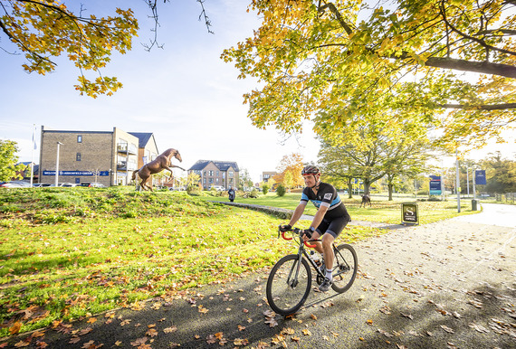 Man cycling through Arborfield