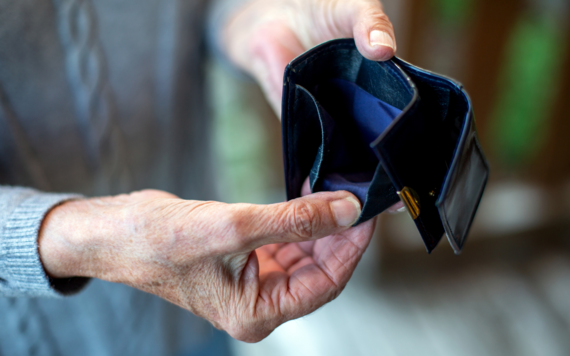 Older person looking in wallet