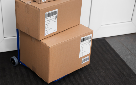 A close-up of two boxes on the doorstep