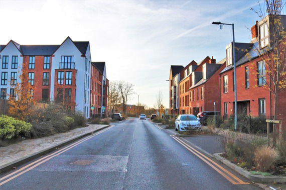 photo of a clean and tidy new road running through the new housing development at Biscoe Way in Wokingham