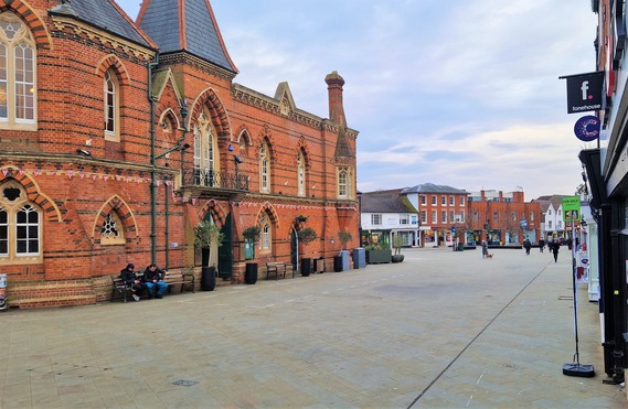 Wide shot of Wokingham Market Place showing the town hall and the paving slabs on the ground