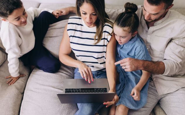 Family looking at a computer