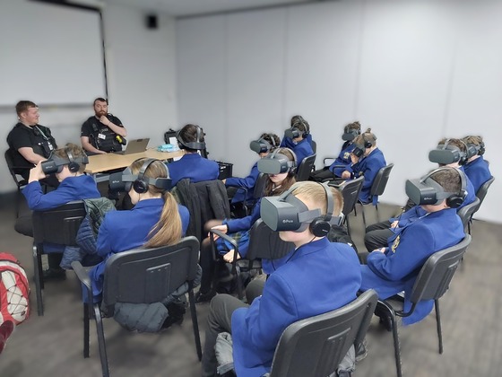 Children wearing VR headsets