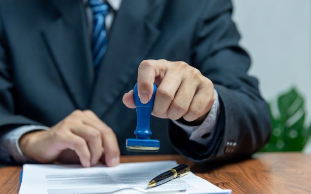 man stamping a document