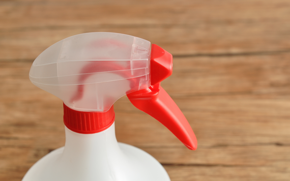 A close-up of the trigger on a plastic bottle