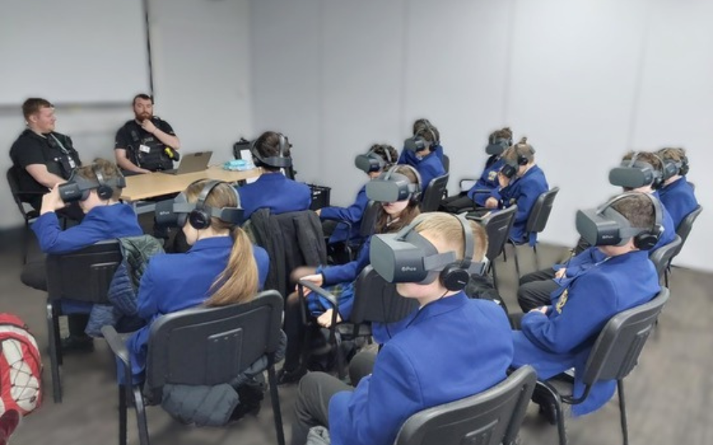 Children wearing VR headsets during a positive choices sessions