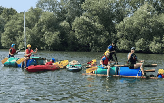 Children on a canoe - Wild Days