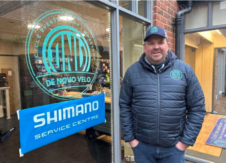 man outside bike shop in Bush Walk