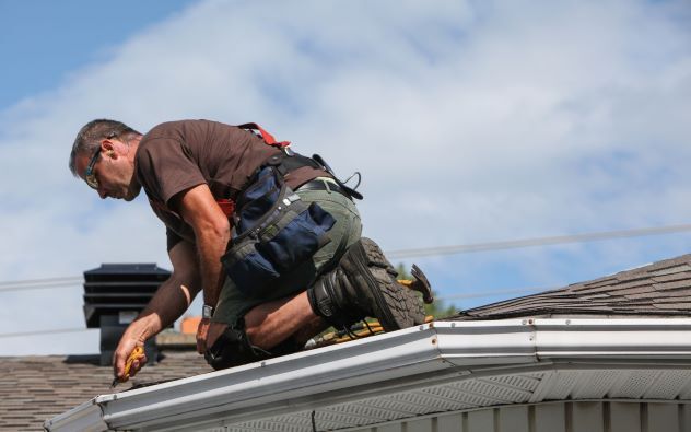 man working on a roof