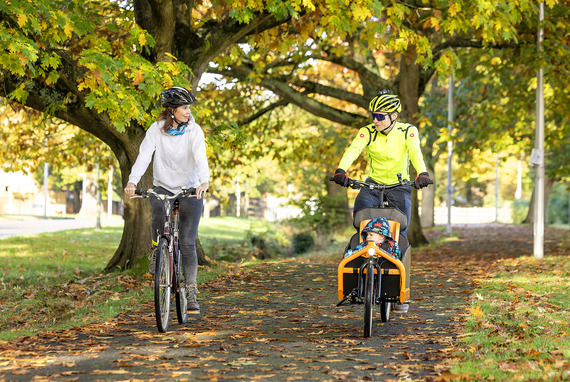 Two cyclists and a child cycling through Arborfield