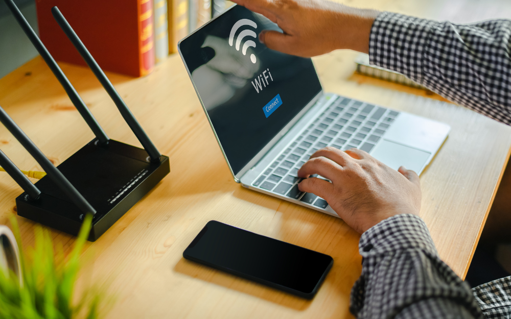 Laptop and phone connecting to a wifi router for internet access