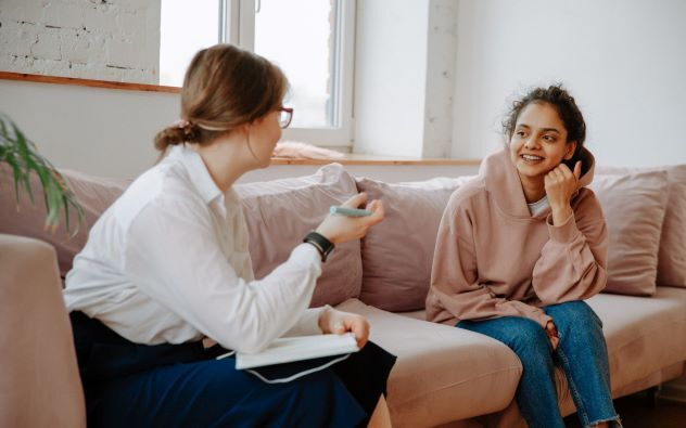 woman talking to a teenager