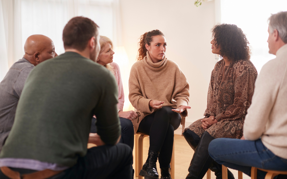A group sitting and discussing mental health