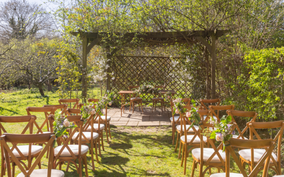 Outdoor wedding under a pergola