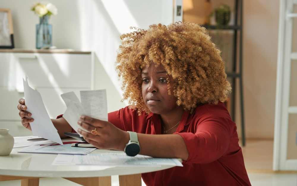 Woman looking at receipts