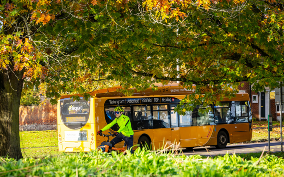 Leopard 3 bus with a cyclist cycling along the cycle path