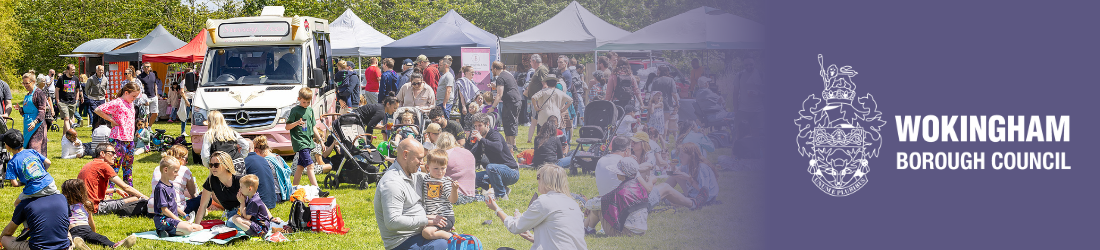 Crowds sat on the ground at a community event in Wokingham Borough