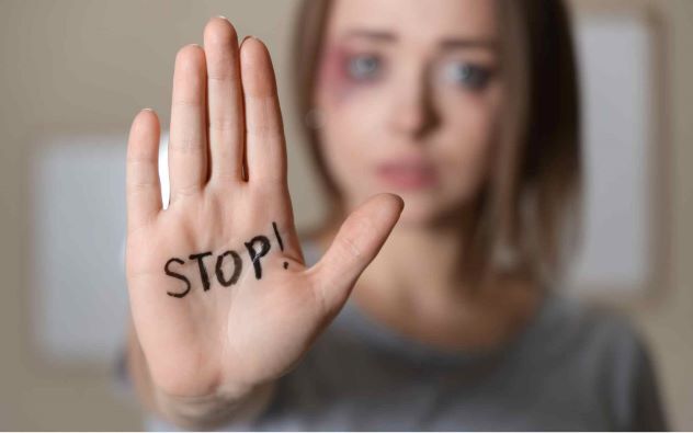 hand with stop written on it