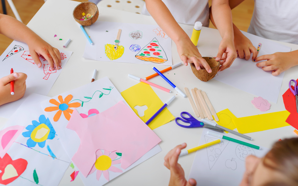 Children doing crafts on a table