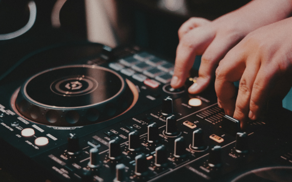 Person using a DJ deck