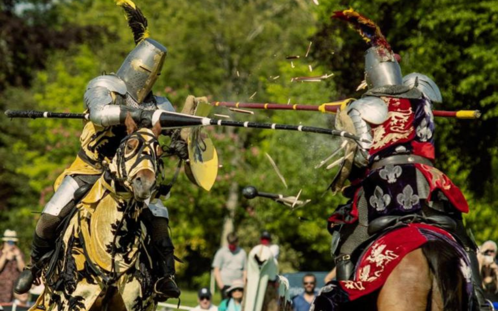Two knights joust on horseback