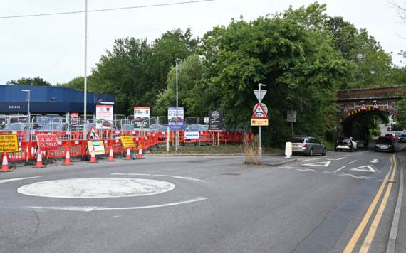 A view of the northern entrance to the roundabout, looking up Finchampstead Road towards the railway bridge