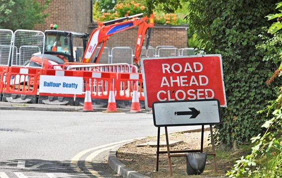 a temporary "road ahead closed" sign at the junction of Molly Millars Lane and Finchampstead Road in Wokingham
