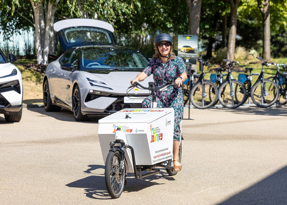 A lady on an electric cargo bike