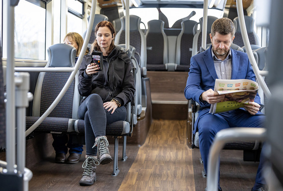 Three passengers on a bus