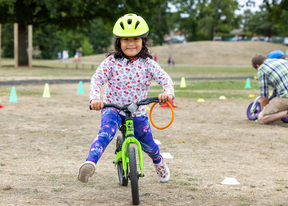 Child riding on balance bike