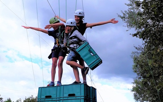 Two children on top of a crate stack