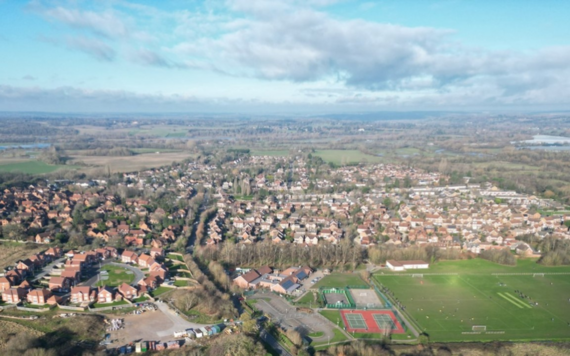 Drone image above housing and greenery in Charvil