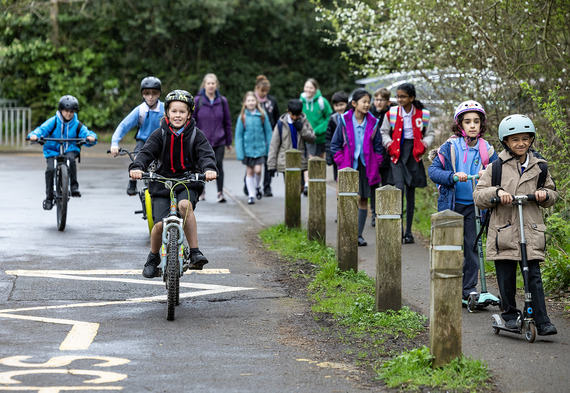 Children walking, cycling or scooting to school