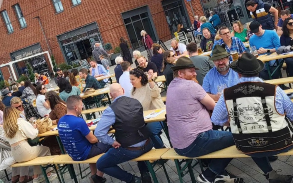 People sat on bench in peach place
