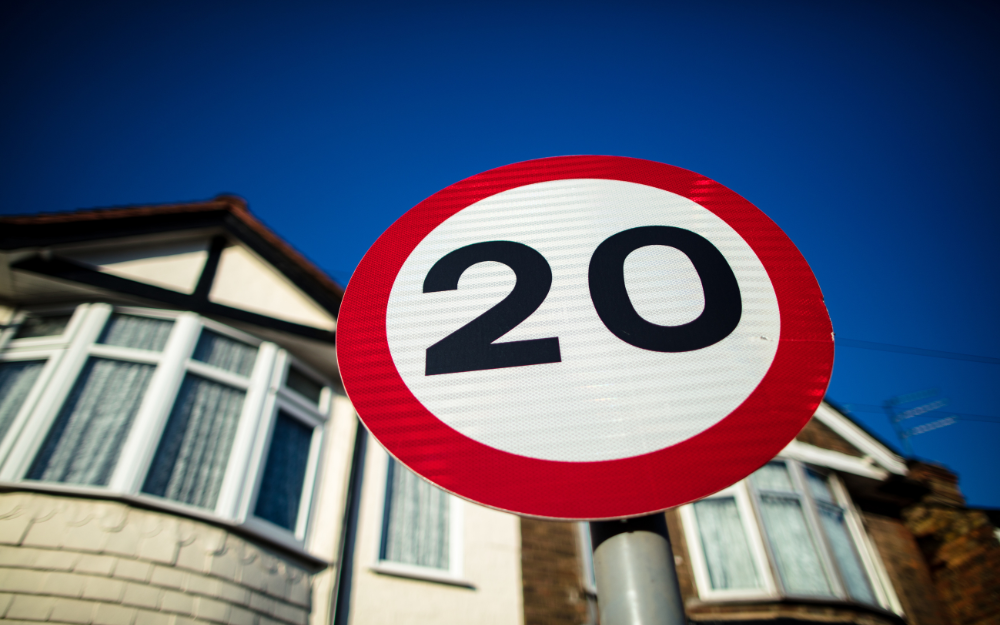 20mph speed limit sign on a residential road