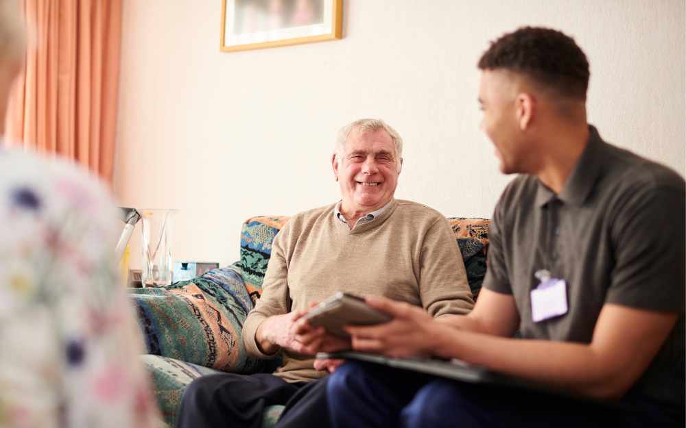 Social worker talking to older resident