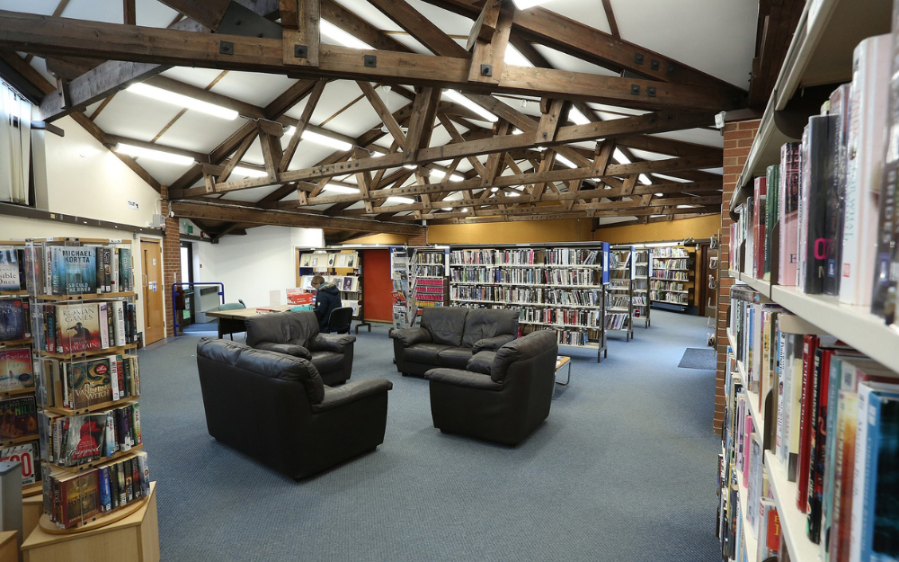 Woodley library interior with bookshelves and relaxed seating areas