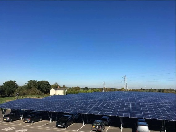Cars underneath a solar canopy at a car park