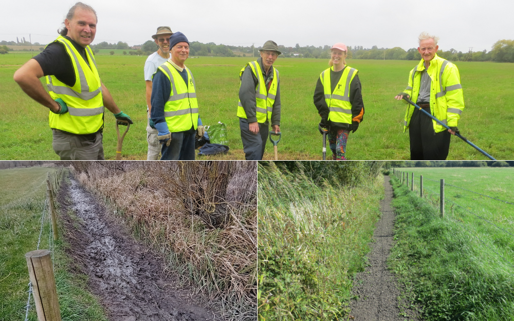 Volunteers in safety vests stand in a field with tools. A muddy ditch and gravel path appear in foreground corners.