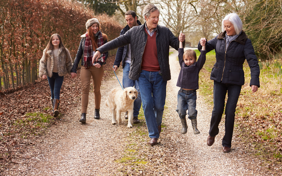 Family out walking with their dog