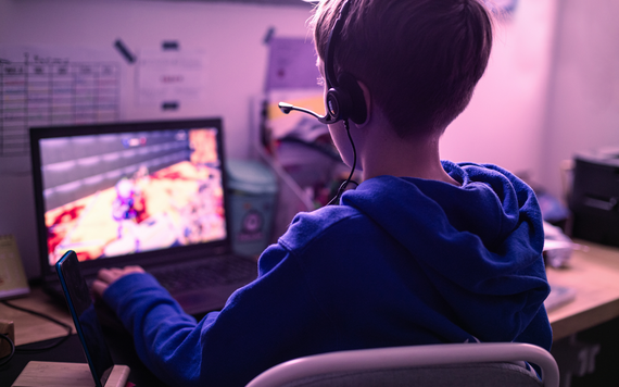 Young boy gaming at computer