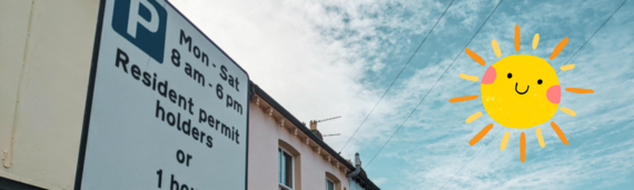 close up of a sign advertising the times and conditions for a residents parking permit zone