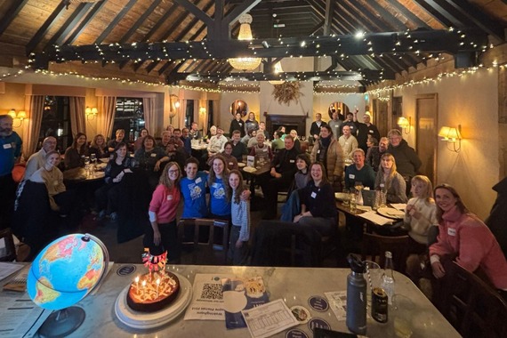 Celebrating three years of People Planet Pint group shot inside The Rose Inn