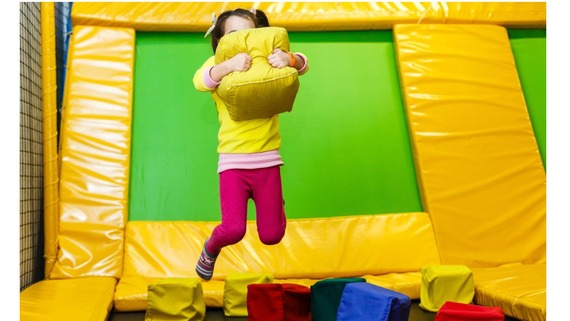 Child jumping on a trampoline