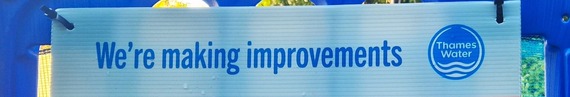 close up on part of a Thames Water sign with the company logo and the words "we're making improvements"